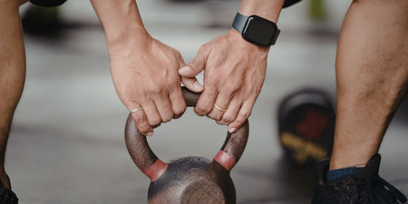 Person holding kettlebell for exercise