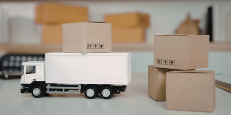 Toy truck with cardboard boxes on it