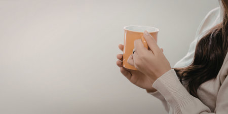 Woman enjoying a warm beverage