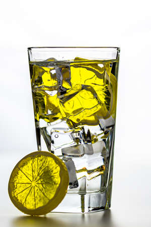Ice cubes, lemon and waterの写真素材