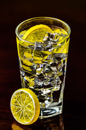 Ice cubes, lemon and waterの写真素材