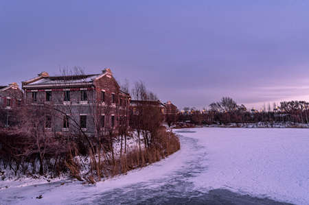 Winter scenery of the North Lake National Wetland Park in Changchun, China under the sunsetのeditorial素材