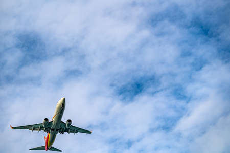 airliner flying in the skyの写真素材