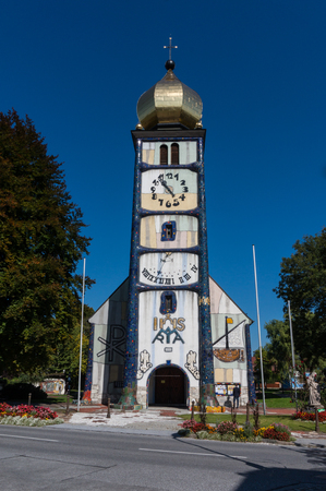  Baernbach, Austria - 23.09.2017: Front view of the Hunertwasser churchのeditorial素材