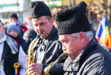 Alba Iulia, Romania - 01.12.2018: Older men playing musical instruments at the National Day paradeのeditorial素材