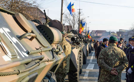 Alba Iulia, Romania - 01.12.2018: Column of armoured personnel carriers waiting to participate in...