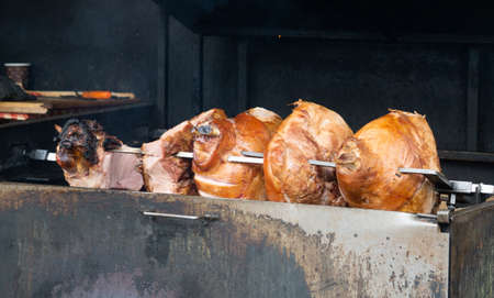 Meat roasting over a charcoal bed in Pragueの写真素材