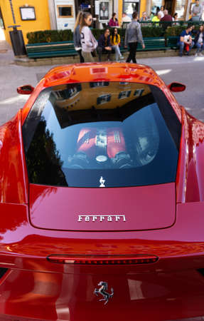 KitzbÃ¼hel, Austria - 30.09.2018: A bright red Ferrari with transparent engine cover on display