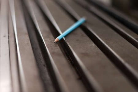 Pencil on Old factory machineの写真素材