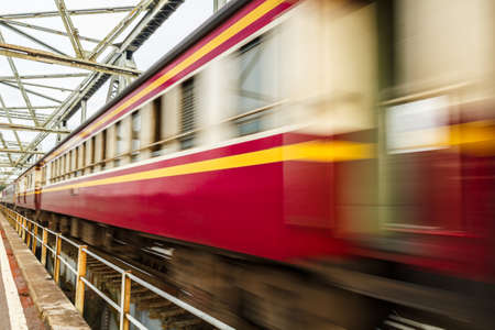 The train runs on the bridge to cross the river.