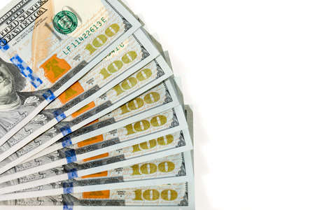 Fan out hundred dollars bills on white background 