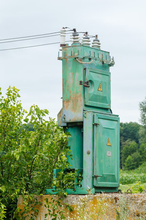 old high voltage transformer and power line.