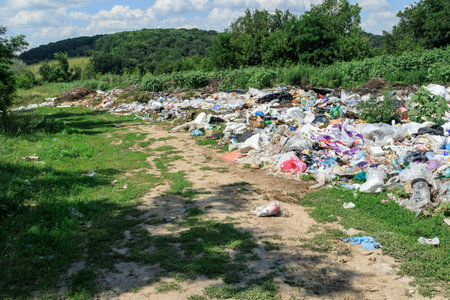 View of the landfill. Landfill A pile of plastic garbage, food waste and other garbage. Pollution of nature. A sea of ââââgarbage begins to invade and destroy beautiful landscapesの写真素材