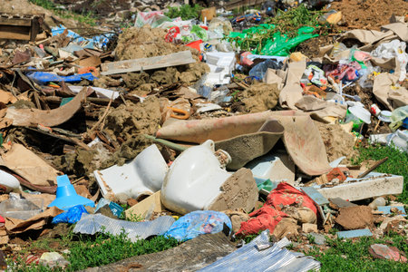 View of the landfill. Landfill A pile of plastic garbage, food waste and other garbage. Environmental pollution. A sea of ââââgarbage begins to invade and destroy the beautiful scenery of the countrysideの写真素材