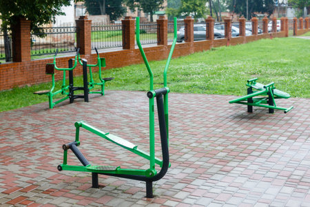 Close-up of an outdoor gym on a sports field in a park. Exercise stations in the public park. Free outdoor gym.の写真素材