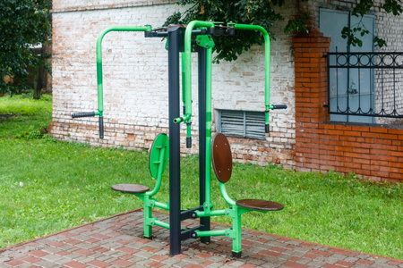 Close-up of an outdoor gym on a sports field in a park. Exercise stations in the public park. Free outdoor gym.の写真素材