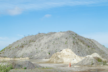 A large pile of rubble for road construction. Crushed stone for concrete mix. large piles of crushed granite or gravel in the concrete industryの写真素材