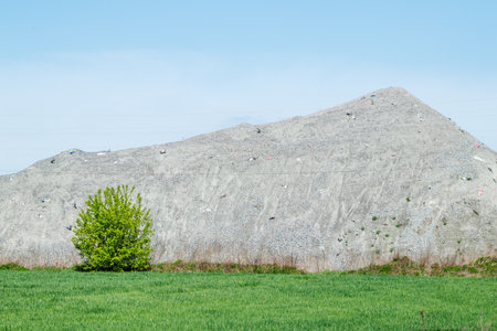 A large pile of rubble for road construction. Crushed stone for concrete mix. large piles of crushed...