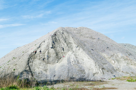 A large pile of rubble for road construction. Crushed stone for concrete mix. large piles of crushed granite or gravel in the concrete industryの写真素材