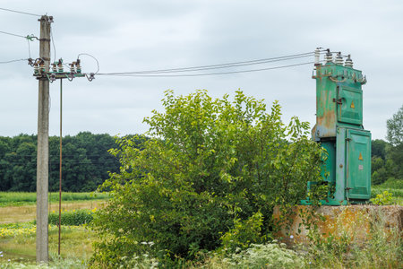 old high voltage transformer and power line.の写真素材