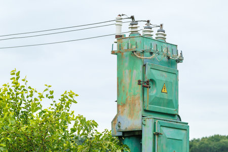 old high voltage transformer and power line.の写真素材
