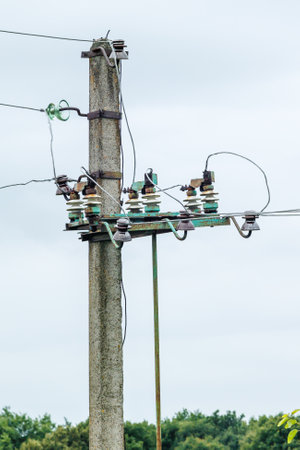 Electric power pole with wire close-up. Wire line in electrical resistance of power supply for residential buildings.の写真素材