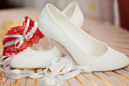 Enlarged white shoes of the bride. Women's wedding shoesの写真素材