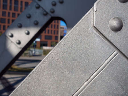 Close-up of construction detail of metal bridge at daylight.の写真素材