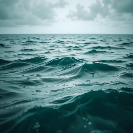 Blue sea water surface with waves. Abstract nature background with copy spaceの素材