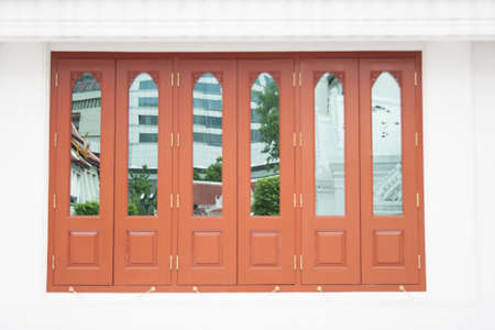 Image of a mirror in a wooden window background