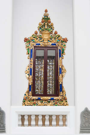 Ancient carving wooden window of Thai templeの写真素材