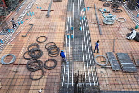 bird-view Construction site with metal and workersのeditorial素材