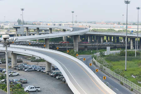 modern concrete elevated roadway and spot-light pole tower