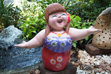 The Sculpture of happy smiling fat girl ceramicの写真素材