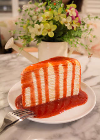 Crape cake with strawberry Sauce and flower pot