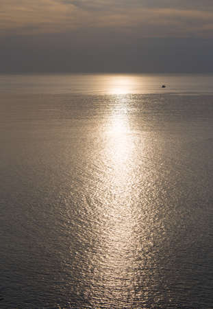 ship pass sea sunset and sunlight reflection