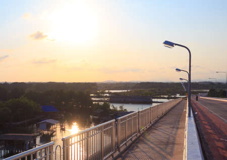 street light pole sunset on highway evening rural countrysideの写真素材