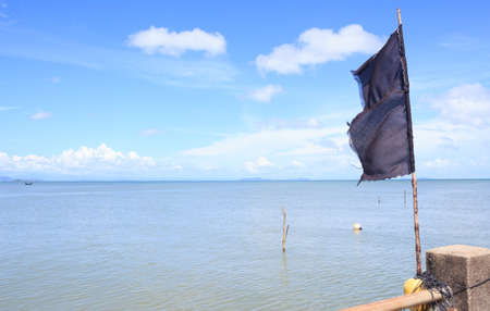 black  flag with blue skyの写真素材