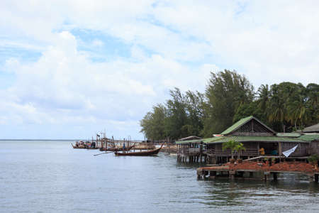 fisherman village and tradition floating home stand on a sea, Trang Thailandの写真素材