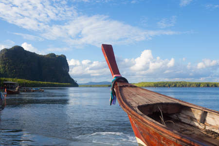 close up head of fishing boat in blue sea water and sunlight reflect, nature landscape  at Trang Thailandの写真素材