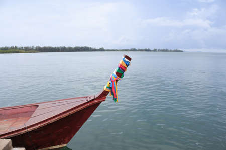 head of side view wooden boat in the tropical-andaman sea Trang, Thailandの写真素材