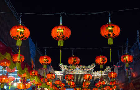 line of chinese lanterns hanging for new year festival celebrationの写真素材