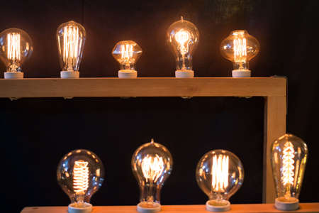 glow yellow design light bulbs in black background