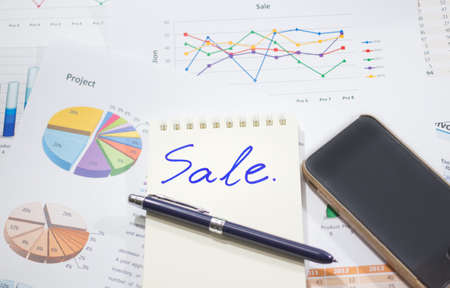 Sale analysis report show result of growth success charts and graphs on document paperwork with laptop, corporate financial and business conceptsの写真素材