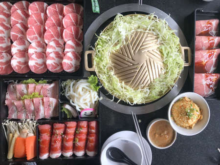 Pork and beef Korean barbecue grill buffet with smileの写真素材