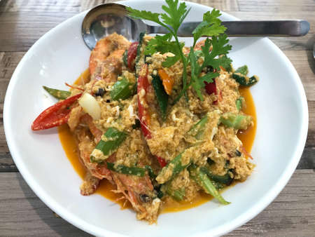 Fried shrimp and crab in yellow curryの写真素材