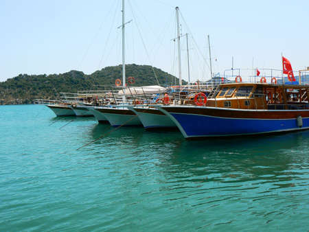 City dock of boats. Marine parking of boats and yachts in Kekova is a sunken city in Turkey.の写真素材
