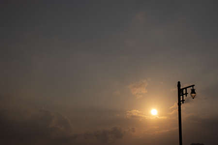 street lamp on steel lamppost in nature early morning, dark blue sky without cloud...