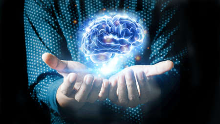 Businessman holding human brain on his hand with logistics symbols around