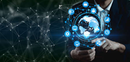 Business people using mobile smartphones on a global network with investors and customers with information exchange and business development, technology sales and digital marketing, finance and banking.の写真素材